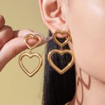 Gold and silver geometric hollow heart chain necklace bracelet and drop earrings set model preview