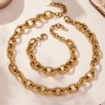tainless steel heavy chunky oval link chain necklace and matching bracelet set available in solid gold plating and two-tone silver gold finish.