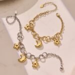 Stainless steel celestial star and cubic zirconia crescent moon charm necklace and matching charm bracelet set in gold and two-tone finishes.