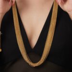 Draped multi-strand liquid chain long necklace and wide cuff bracelet jewelry set in gold, silver, and two-tone stainless steel finishes.