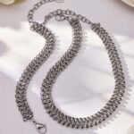 316L stainless steel woven mesh link chain choker necklace and matching bracelet jewelry set in 18K gold and silver finishes.