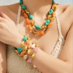 Chunky irregular resin nugget and gold plated molten metallic beaded necklace and bracelet set