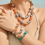 Chunky irregular resin nugget and gold plated molten metallic beaded necklace and bracelet set