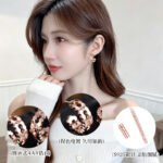Rose gold cutout hoop earrings featuring scalloped edges, hexagonal cutout pattern, AAA cubic zirconia accents, and 925 sterling silver posts.