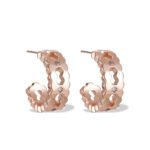 Rose gold cutout hoop earrings featuring scalloped edges, hexagonal cutout pattern, AAA cubic zirconia accents, and 925 sterling silver posts.