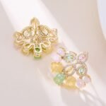 Vintage chandelier CZ fan stud earrings featuring marquise halo frames, oval ice-flower textured stones, and 925 sterling silver ear posts
