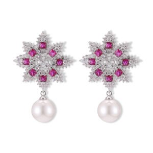 Snowflake CZ freshwater pearl drop earrings featuring an intricate starburst starburst pattern, princess-cut gems, micro-paved borders, and a round freshwater pearl dangle