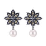Snowflake CZ freshwater pearl drop earrings featuring an intricate starburst starburst pattern, princess-cut gems, micro-paved borders, and a round freshwater pearl dangle