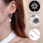 Snowflake CZ freshwater pearl drop earrings featuring an intricate starburst starburst pattern, princess-cut gems, micro-paved borders, and a round freshwater pearl dangle