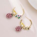 Hand-painted enamel squirrel and pearl blackberry cluster hoop earrings featuring white floral blossoms, a swinging pearl berry cluster, and 925 sterling silver ear posts