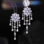 Floral CZ chandelier tassel earrings featuring a flower cluster stud, cascading teardrop gemstone fringes, and 925 sterling silver ear posts.