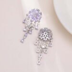 Floral CZ chandelier tassel earrings featuring a flower cluster stud, cascading teardrop gemstone fringes, and 925 sterling silver ear posts.