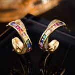 Rainbow CZ C-shape hoop earrings featuring channel-set multi-color square cubic zirconia, paved crossover border, and 925 sterling silver posts