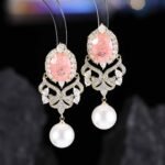 Vintage oval stone pearl drop earrings wholesale featuring an oval crackle gemstone surrounded by cubic zirconia halo, filigree chandelier dangles, and a freshwater pearl drop from junejewelry.com