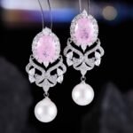 Vintage oval stone pearl drop earrings wholesale featuring an oval crackle gemstone surrounded by cubic zirconia halo, filigree chandelier dangles, and a freshwater pearl drop from junejewelry.com