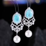 Vintage oval stone pearl drop earrings wholesale featuring an oval crackle gemstone surrounded by cubic zirconia halo, filigree chandelier dangles, and a freshwater pearl drop from junejewelry.com
