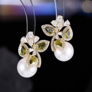 Luxury freshwater pearl CZ cluster stud earrings featuring pear-cut colored gemstones, sparkling crystal sprays, and 925 sterling silver posts available on junejewelry.com