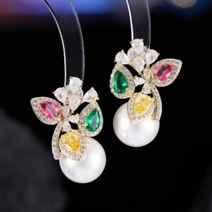 Luxury freshwater pearl CZ cluster stud earrings featuring pear-cut colored gemstones, sparkling crystal sprays, and 925 sterling silver posts available on junejewelry.com