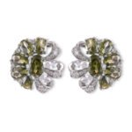 Floral pinwheel CZ cluster stud earrings featuring a swirling halo of multi-cut gemstones, micro-paved ribbon swirls, and 925 sterling silver ear posts