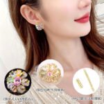 Floral pinwheel CZ cluster stud earrings featuring a swirling halo of multi-cut gemstones, micro-paved ribbon swirls, and 925 sterling silver ear posts