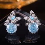 Butterfly CZ rose cut stud earrings featuring a paved openwork butterfly motif set atop a large rose-cut main gem with 925 sterling silver posts