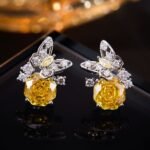 Butterfly CZ rose cut stud earrings featuring a paved openwork butterfly motif set atop a large rose-cut main gem with 925 sterling silver posts