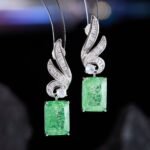 Crackle ice flower CZ wing drop earrings featuring a swept pavé wing design and rectangular ice crackle gem with 925 sterling silver posts