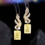 Crackle ice flower CZ wing drop earrings featuring a swept pavé wing design and rectangular ice crackle gem with 925 sterling silver posts