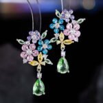 Floral gem CZ bouquet drop earrings featuring a cluster of colorful marquise flower petals, marquise leaves, a dangling teardrop gem, and 925 sterling silver ear posts