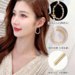 Cubic zirconia oval hoop earrings featuring continuous prong-set round stones, available in gold and silver tones in two sizes.