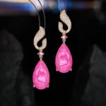 Teardrop gemstone drop earrings wholesale featuring a pavé cubic zirconia flame-top design, a small round gemstone accent, and a large pear-cut crystal drop with 925 silver posts from junejewelry.com