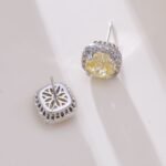 Square cushion-cut rose cut cubic zirconia stud earrings with micro-pave crystal halos in soft pink, canary yellow, and icy blue options.