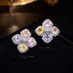 Four leaf clover CZ stud earrings with multi-colored cushion cut crystals, micro-pave halos, and 925 sterling silver posts.