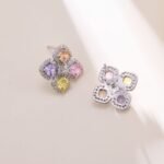 Four leaf clover CZ stud earrings with multi-colored cushion cut crystals, micro-pave halos, and 925 sterling silver posts.