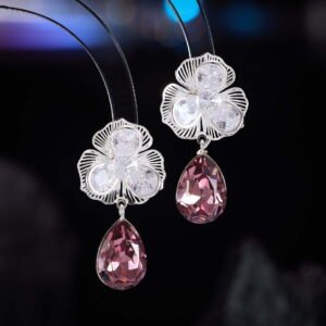 Floral crystal teardrop drop earrings with clear cubic zirconia petals, platinum plating, and faceted emerald green or amethyst purple crystal drops.