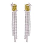 Long tassel CZ drop earrings featuring a cushion-cut colored crystal stud with marquee crystal butterfly accents and cascading cubic zirconia fringe strands on palladium-plated brass with 925 sterling silver posts.