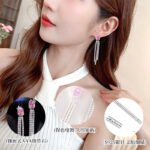 Long tassel CZ drop earrings featuring a cushion-cut colored crystal stud with marquee crystal butterfly accents and cascading cubic zirconia fringe strands on palladium-plated brass with 925 sterling silver posts.