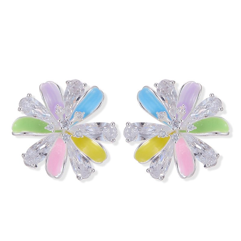 Layered bloom stud earrings featuring alternating glossy enamel petals and marquise-cut clear CZ crystals, available in yellow, sky blue, and pastel rainbow options.