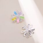 Layered bloom stud earrings featuring alternating glossy enamel petals and marquise-cut clear CZ crystals, available in yellow, sky blue, and pastel rainbow options.