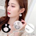 Enamel shell CZ drop earrings featuring pear-cut stud stones, shimmering pastel fan pendants, paved cubic zirconia trim, and 925 sterling silver ear posts.