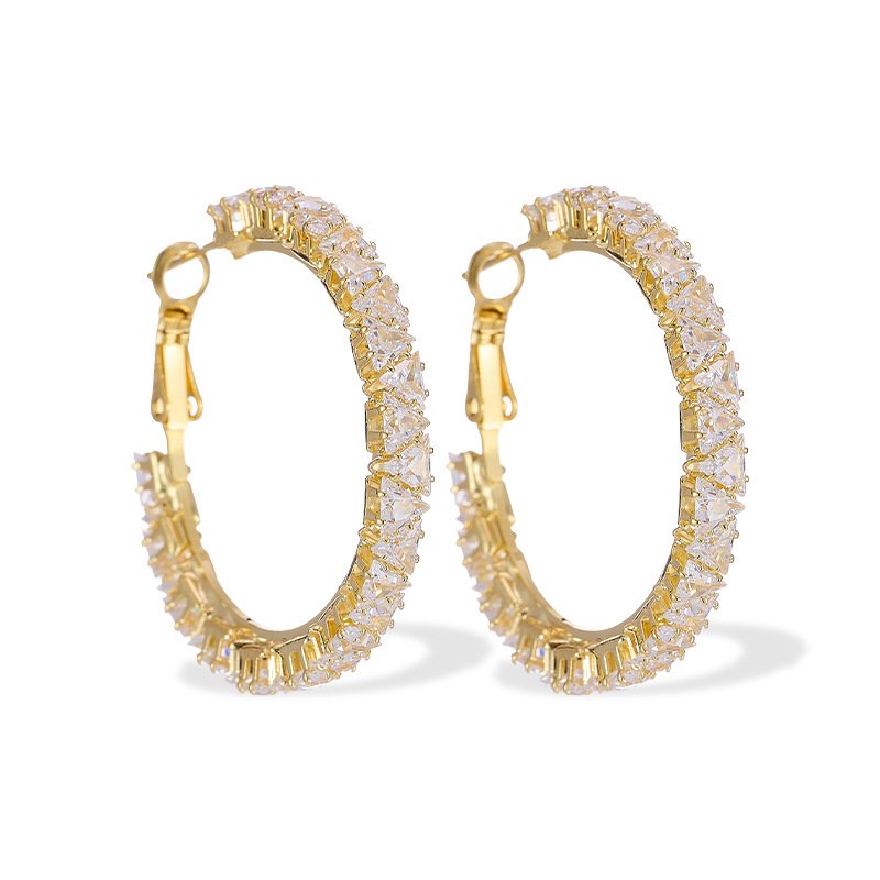 Round hoop earrings set with continuous sparkling clear cubic zirconia crystals, available in gold and silver finishes.