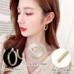 Round hoop earrings set with continuous sparkling clear cubic zirconia crystals, available in gold and silver finishes.