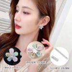 Five-petal flower stud earrings crafted with pear-cut crackle glass stones, featuring a pavé crystal starfish centerpiece in pink, green, and pastel rainbow colorways.