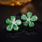 Five-petal flower stud earrings crafted with pear-cut crackle glass stones, featuring a pavé crystal starfish centerpiece in pink, green, and pastel rainbow colorways.