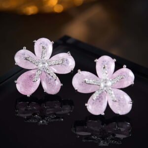 Five-petal flower stud earrings crafted with pear-cut crackle glass stones, featuring a pavé crystal starfish centerpiece in pink, green, and pastel rainbow colorways.