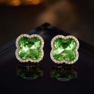 Clover crystal stud earrings with aquamarine cushion-cut center stone, micro-pave halo setting, and 925 sterling silver posts.