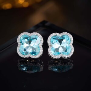 Clover crystal stud earrings with aquamarine cushion-cut center stone, micro-pave halo setting, and 925 sterling silver posts.