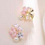 Enamel flower pearl CZ stud earrings featuring pastel resin petals, freshwater pearl accents, square crystal stone, and 925 sterling silver posts.