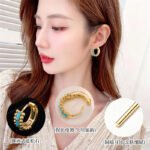 Small beaded huggie hoop earrings set with baguette-cut turquoise stones and flanked by textured metal beads in gold and silver plating options.