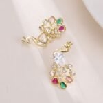 Peacock CZ crystal stud earrings featuring pear-cut body stone and colorful teardrop feather CZ accents with 925 sterling silver posts.
